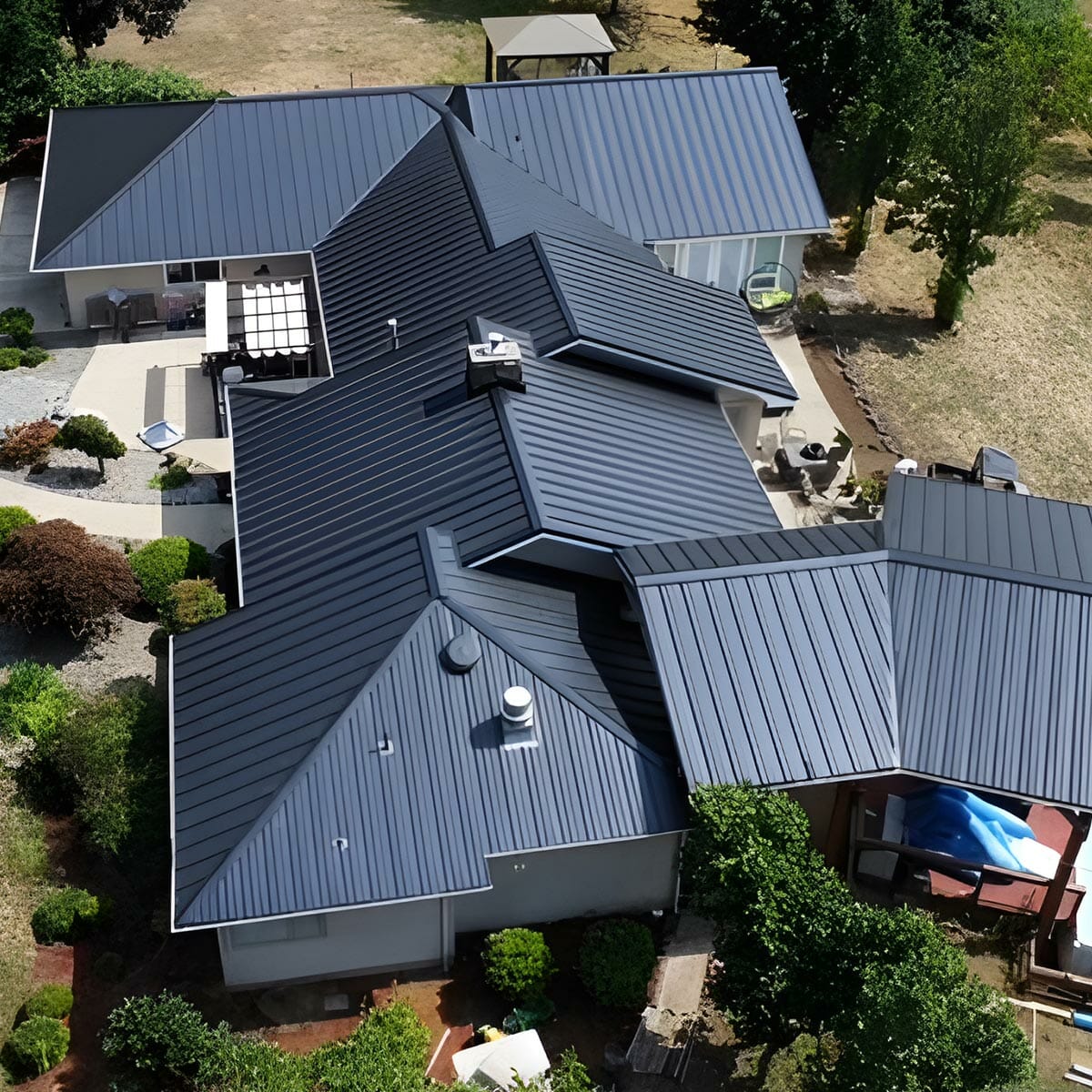 White ranch house with dark shingle roof.