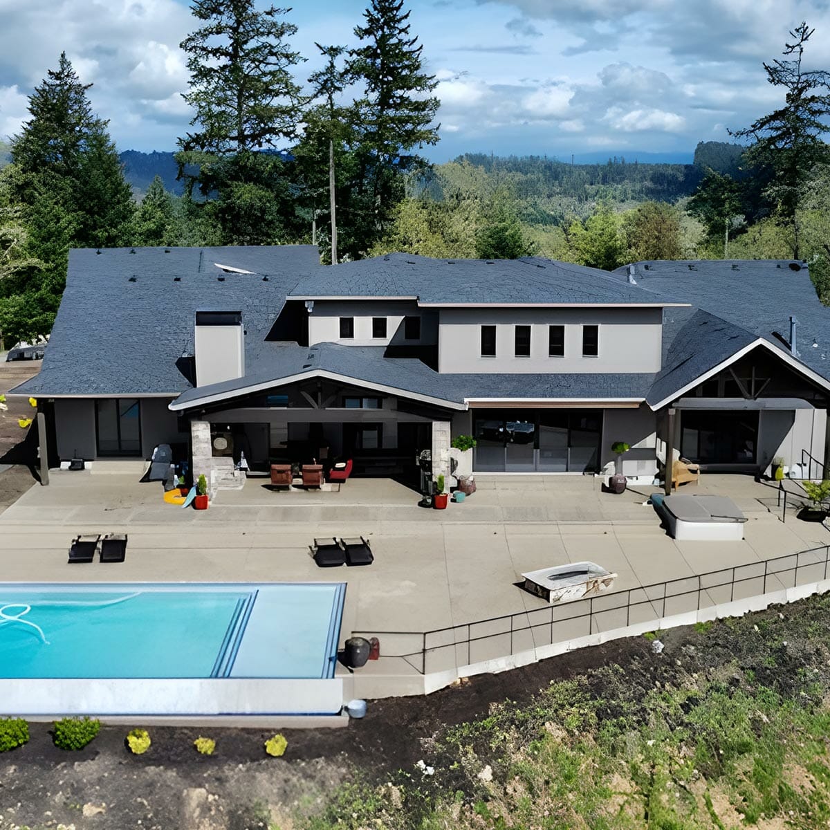 Contemporary home with pool and gray shingles.