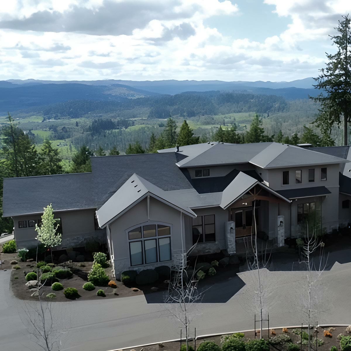 Luxury hillside estate with tiered shingle roof.