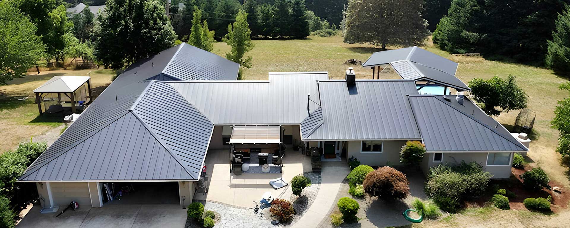 Large modern house with dark metal roof